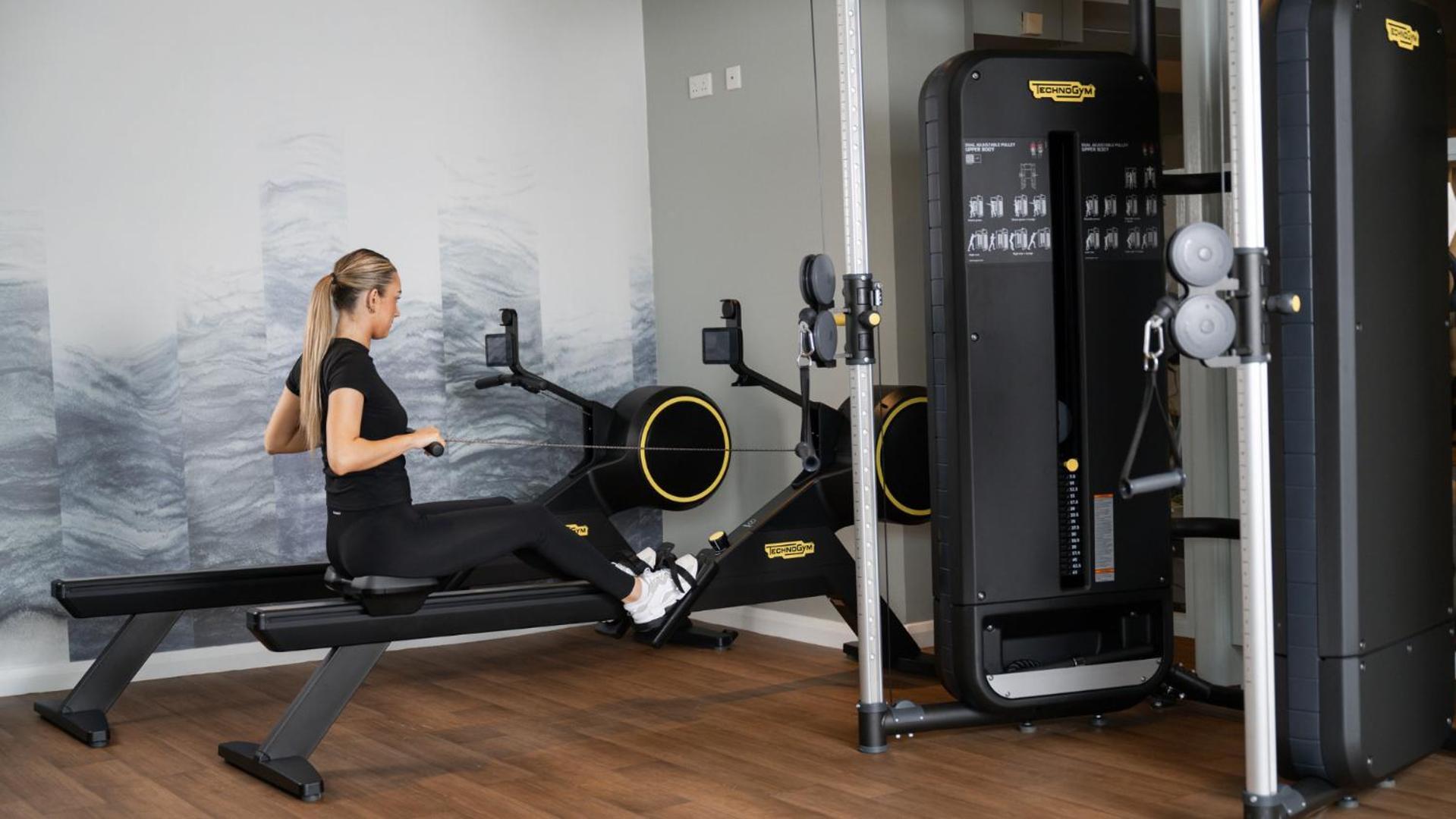 The Culloden Estate And Spa Holywood  Exterior foto A woman using a rowing machine